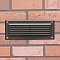 Kichler 15773AZT27R louvered brick light with 2700K warm white illumination in architectural bron...